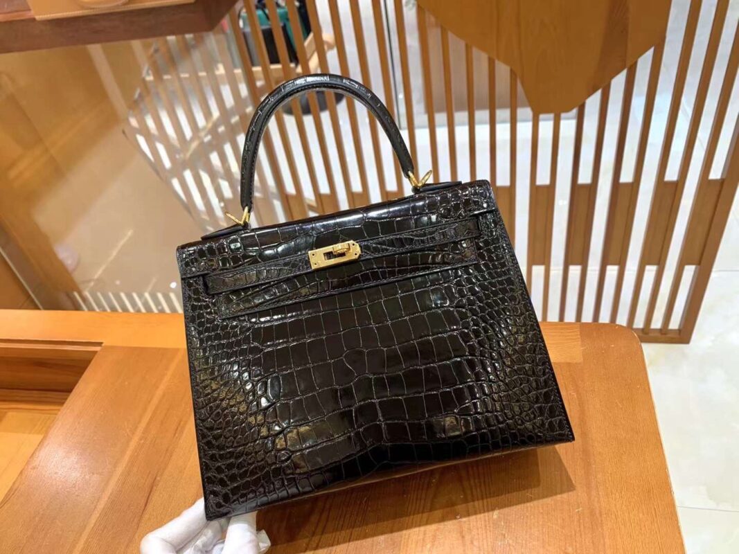 Kelly 25 in Noir Crocodile