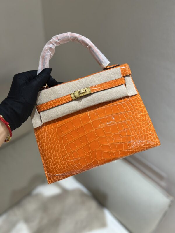 Kelly 25 in Orange Shiny Alligator