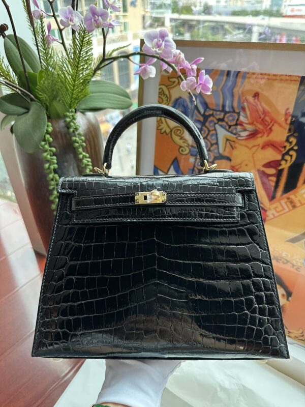 Kelly 25 in Noir Shiny Nile Crocodile