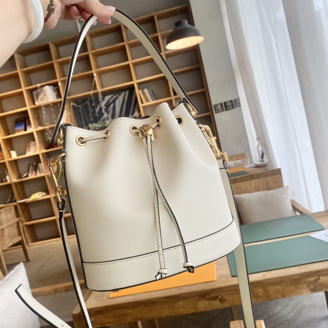 1000024606.jpg Tory Burch Monogram New Drawstring Bucket Bag - Image 1