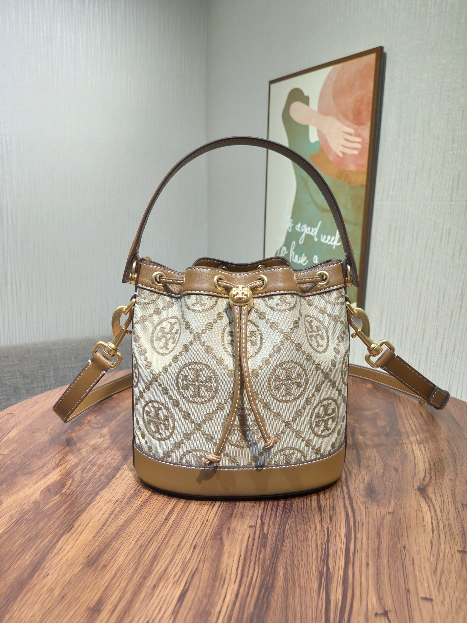 1000024642.jpg Tory Burch Monogram New Drawstring Bucket Bag - Image 1