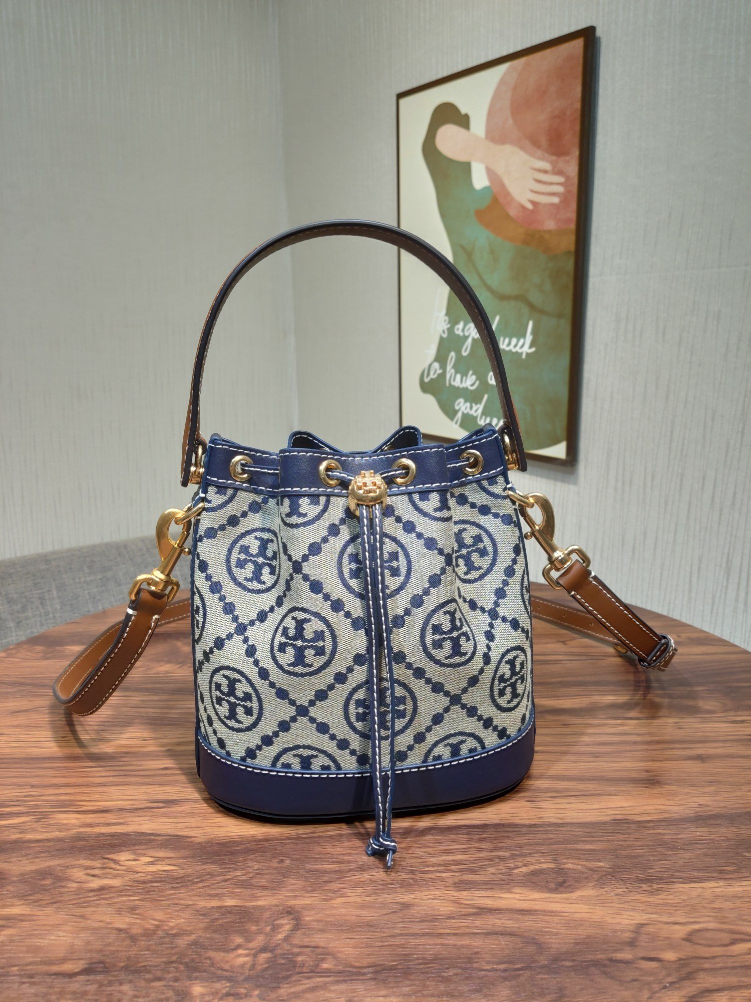 1000024651.jpg Tory Burch Monogram New Drawstring Bucket Bag - Image 1