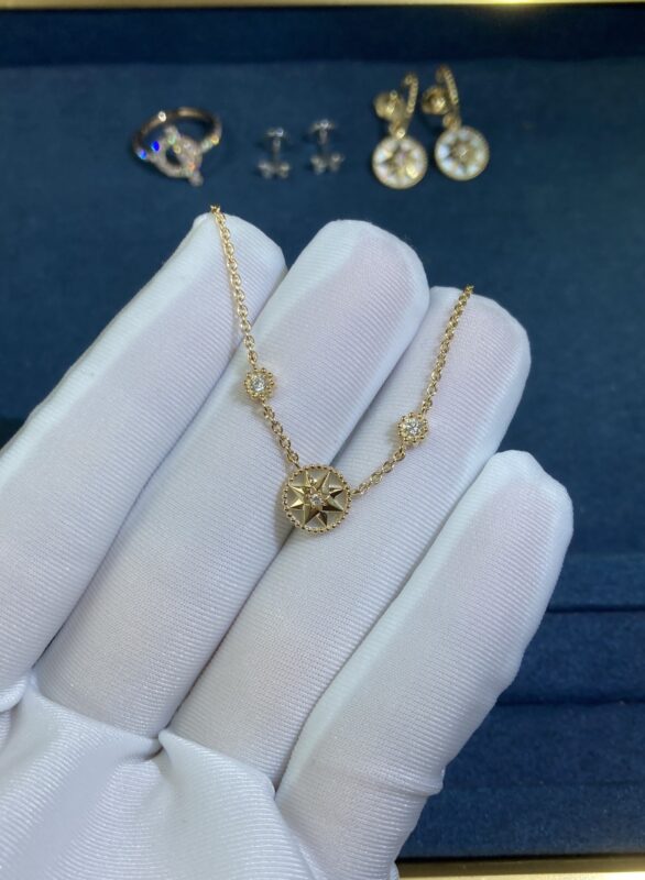 White shell compass necklace, yellow gold