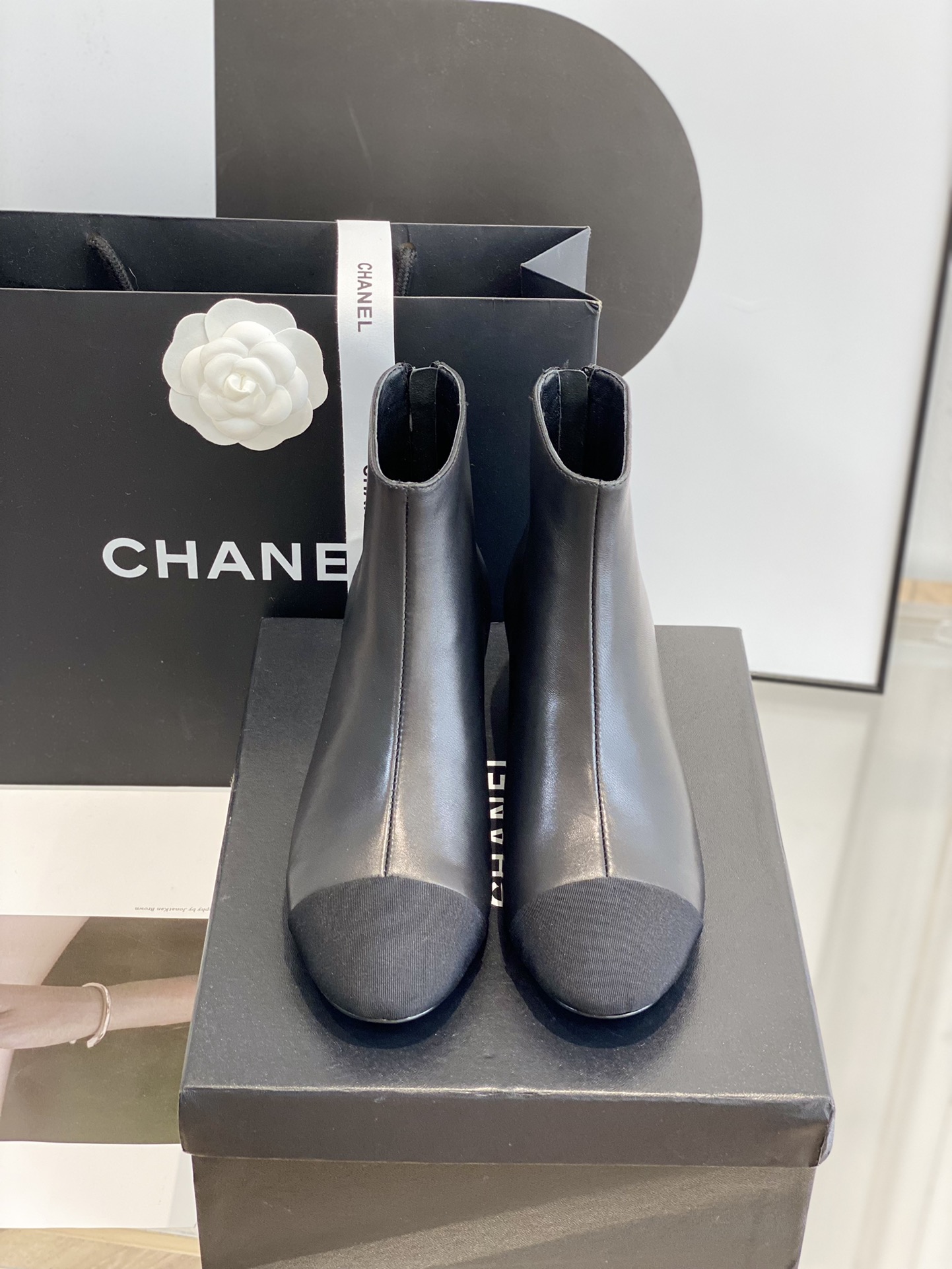 b3869c_d3aab04fc89f4408b242d038756be1a9mv2.jpg Chanel Chunky Heel Short Boots - Image 1