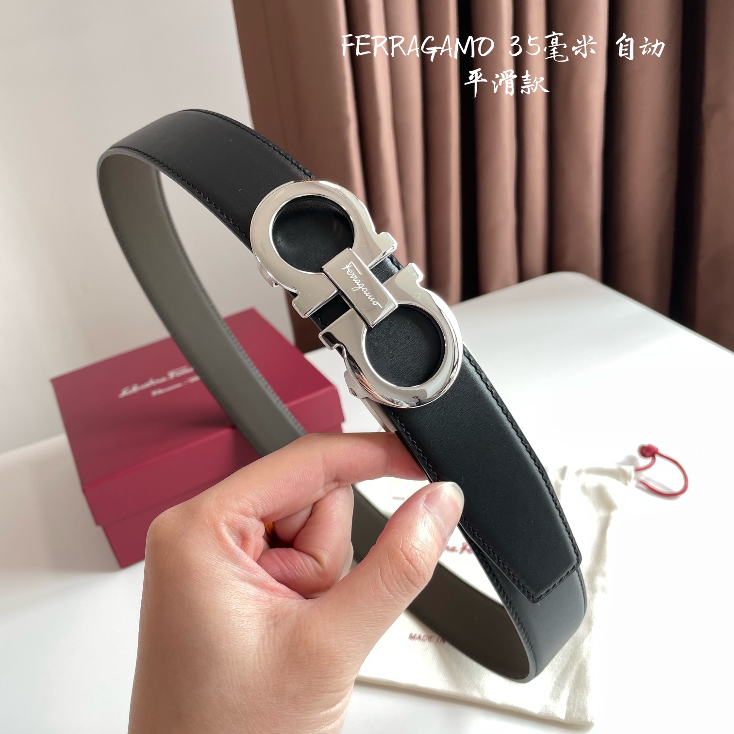 db9bf2_14f7d5362d29477c971df71c661c7161mv2.jpg Ferragamo Logo Buckle Automatic Smoothing Leather Belt - Image 1