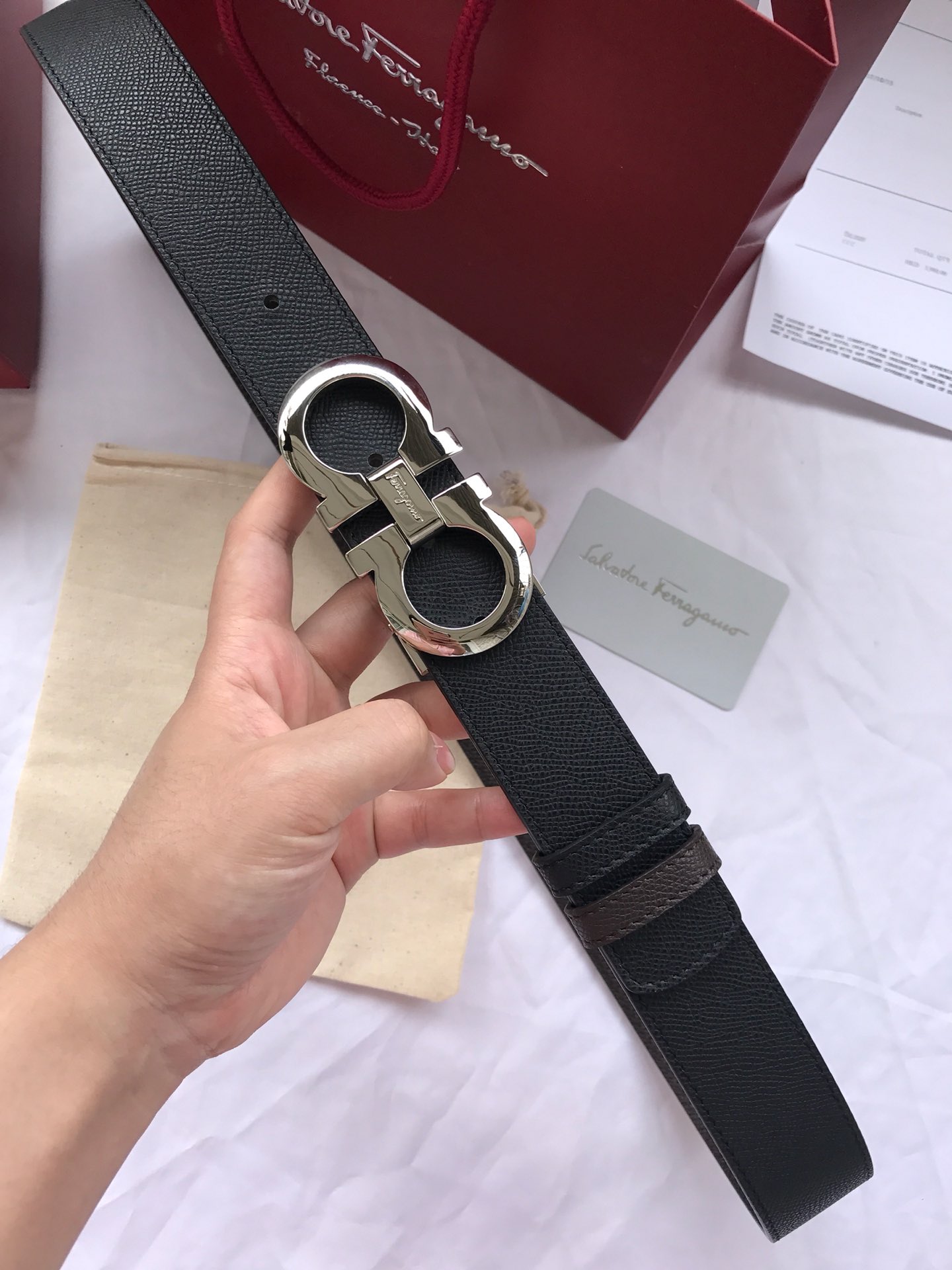 db9bf2_37b4290152054fc09ee989424259a915mv2.jpg Ferragamo Gancini Buckle Leather Belt - Image 1