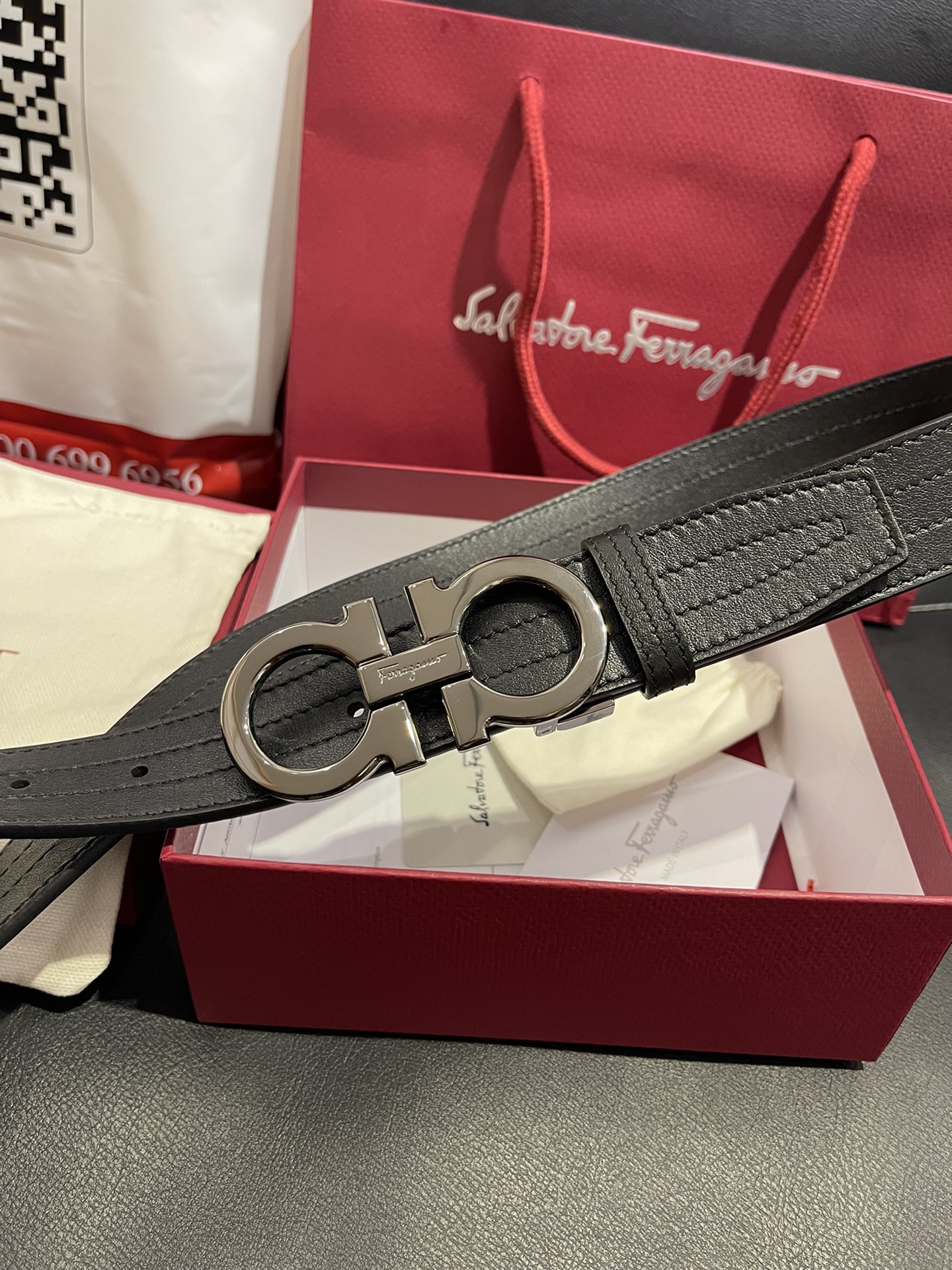 db9bf2_43f39ad779e24e558dbf48bda5e4d791mv2.jpg Ferragamo Adjustable Gancini Leather Belt - Image 1