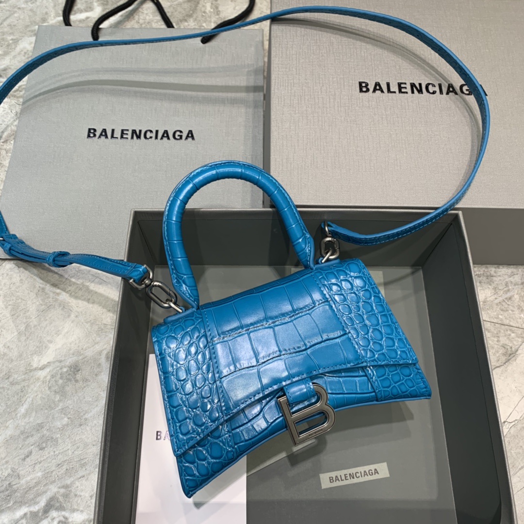 db9bf2_44ae2792a6b24e9f9b42dc62f65d63cbmv2.jpg Balenciaga Mini Hourglass Bag in Glazed Blue Crocodile Pattern - Image 1