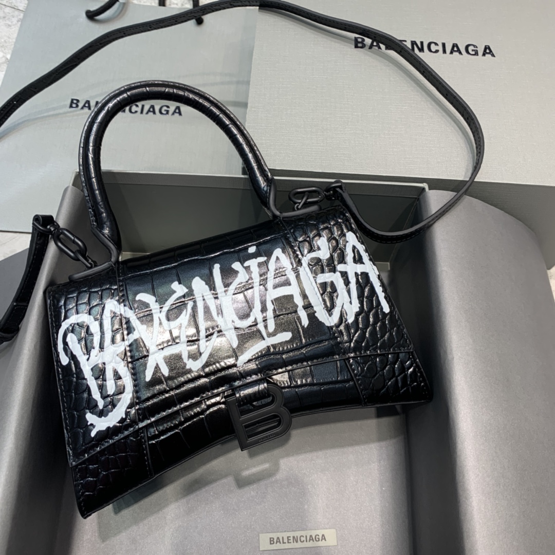 db9bf2_463d60af406c4b20aef9dfa20b214d9amv2.jpg Balenciaga Small Graffiti Hourglass Bag in Black Crocodile Pattern - Image 1