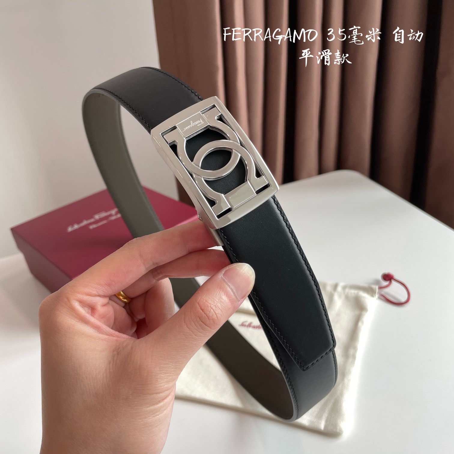 db9bf2_52a4a4214f6140c891f10c550e6f1bafmv2.jpg Ferragamo Logo Buckle Automatic Smoothing Leather Belt - Image 1