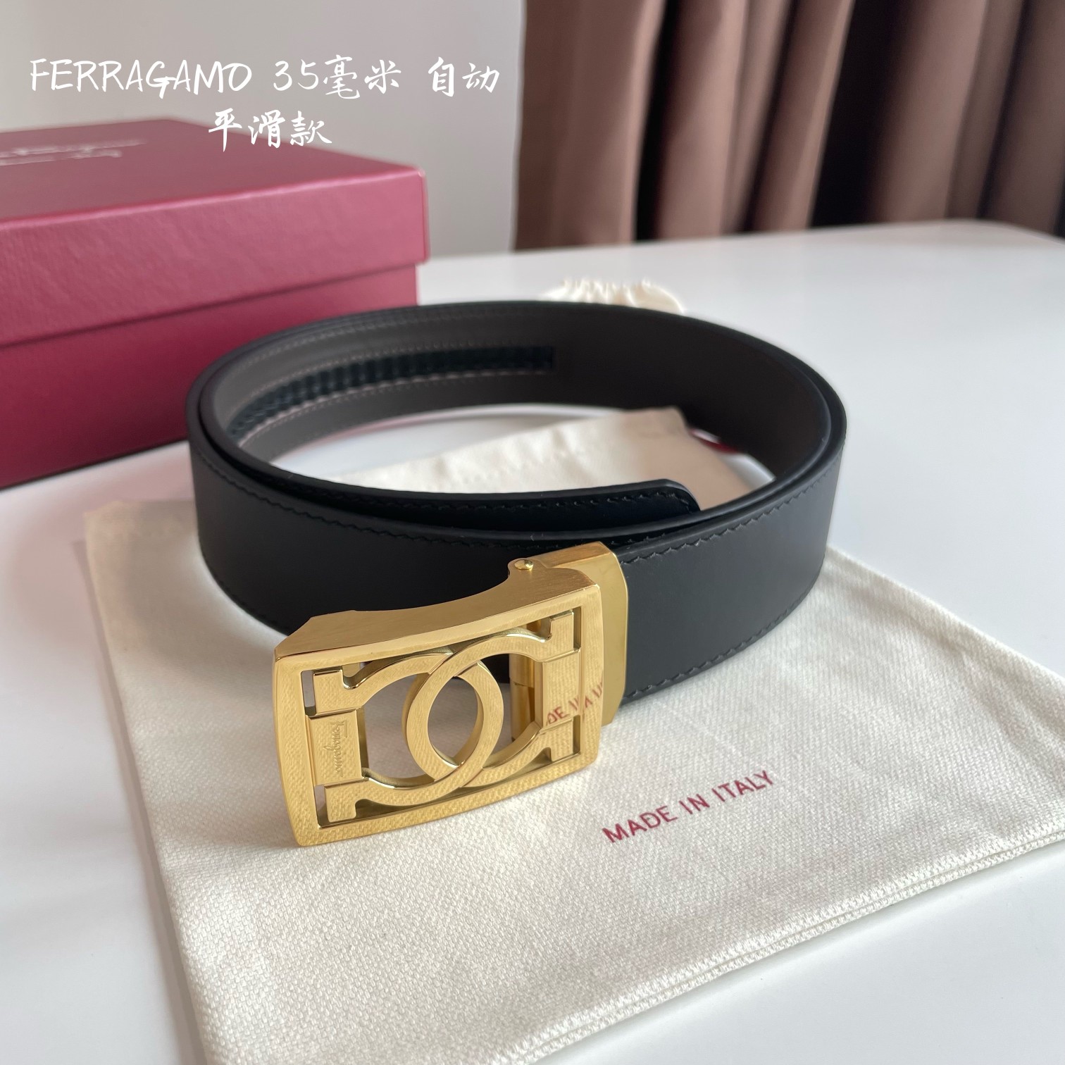 db9bf2_56aeb5bfc50d44bfbb547ca08e6788bcmv2.jpg Ferragamo Logo Buckle Automatic Smoothing Leather Belt - Image 1