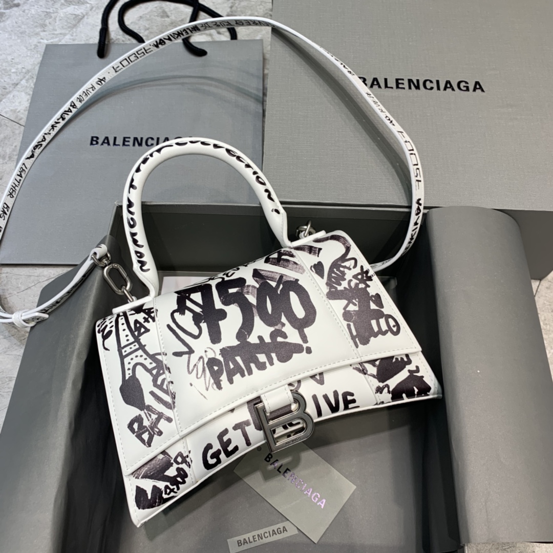 db9bf2_586084e21d2f4a54ab69490b717a825cmv2.jpg Balenciaga Small Hourglass Bag in Graffiti White - Image 1