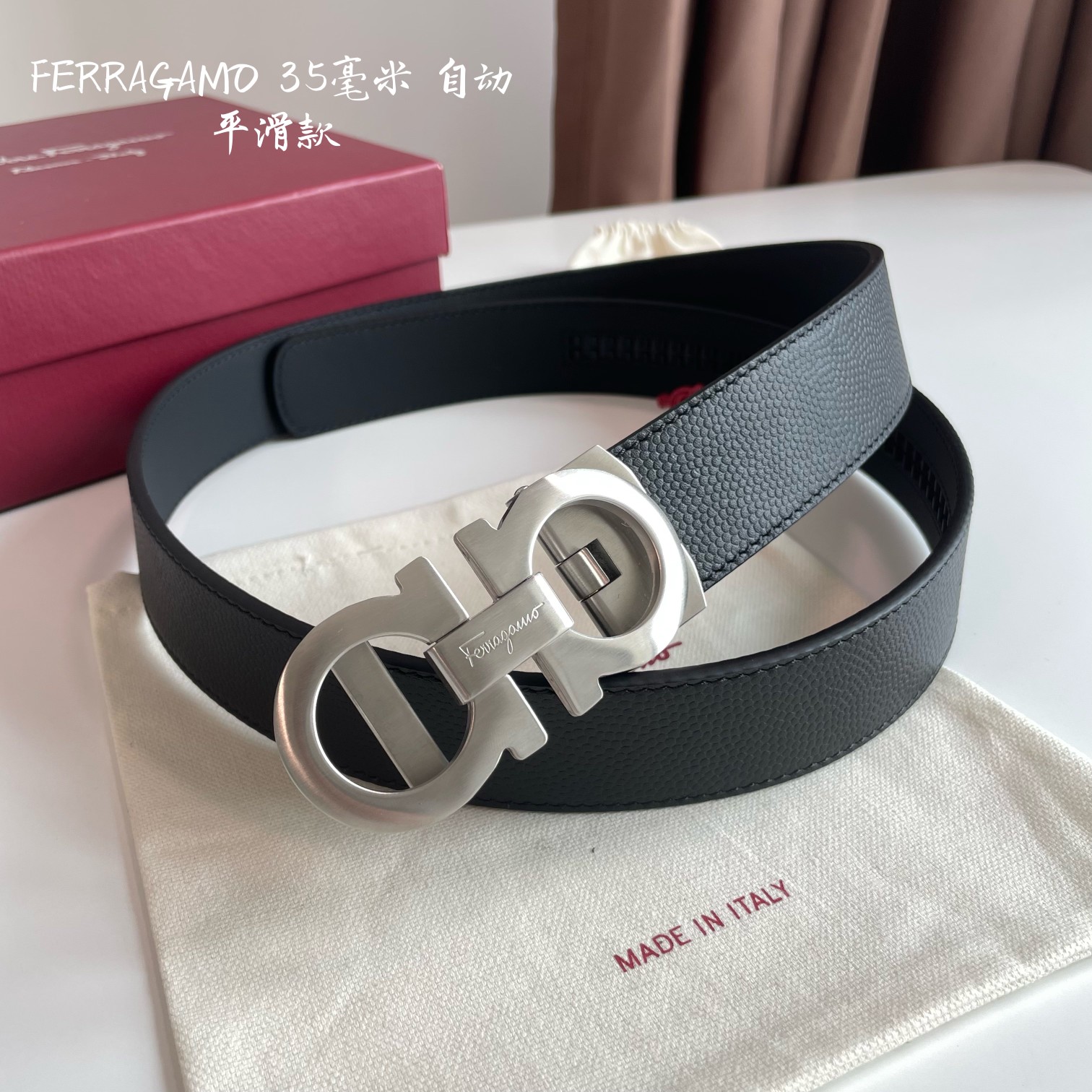db9bf2_78c81b7828c4495b997800da3db8dad5mv2.jpg Ferragamo Logo Buckle Automatic Smoothing Leather Belt - Image 1
