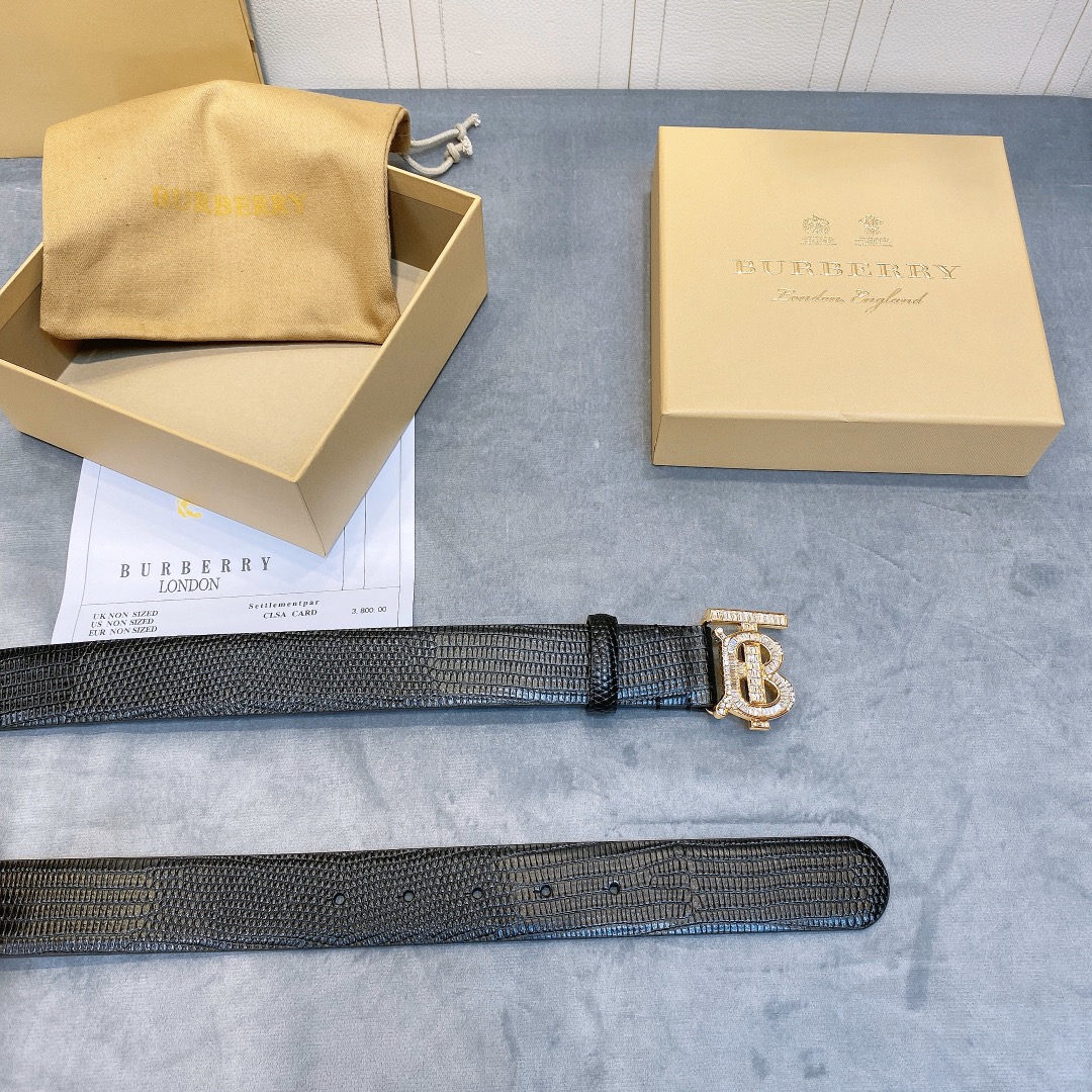 db9bf2_7be470b5769e402aab06fd25b48ddf55mv2.jpg Burberry Rhinestone Decorated TB Buckle Leather Belt - Image 1