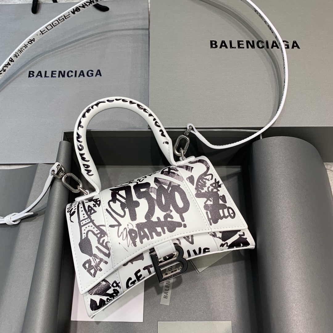 db9bf2_892e629010be426482974b6f384de3a8mv2.jpg Balenciaga Mini Hourglass Bag in Graffiti White - Image 1