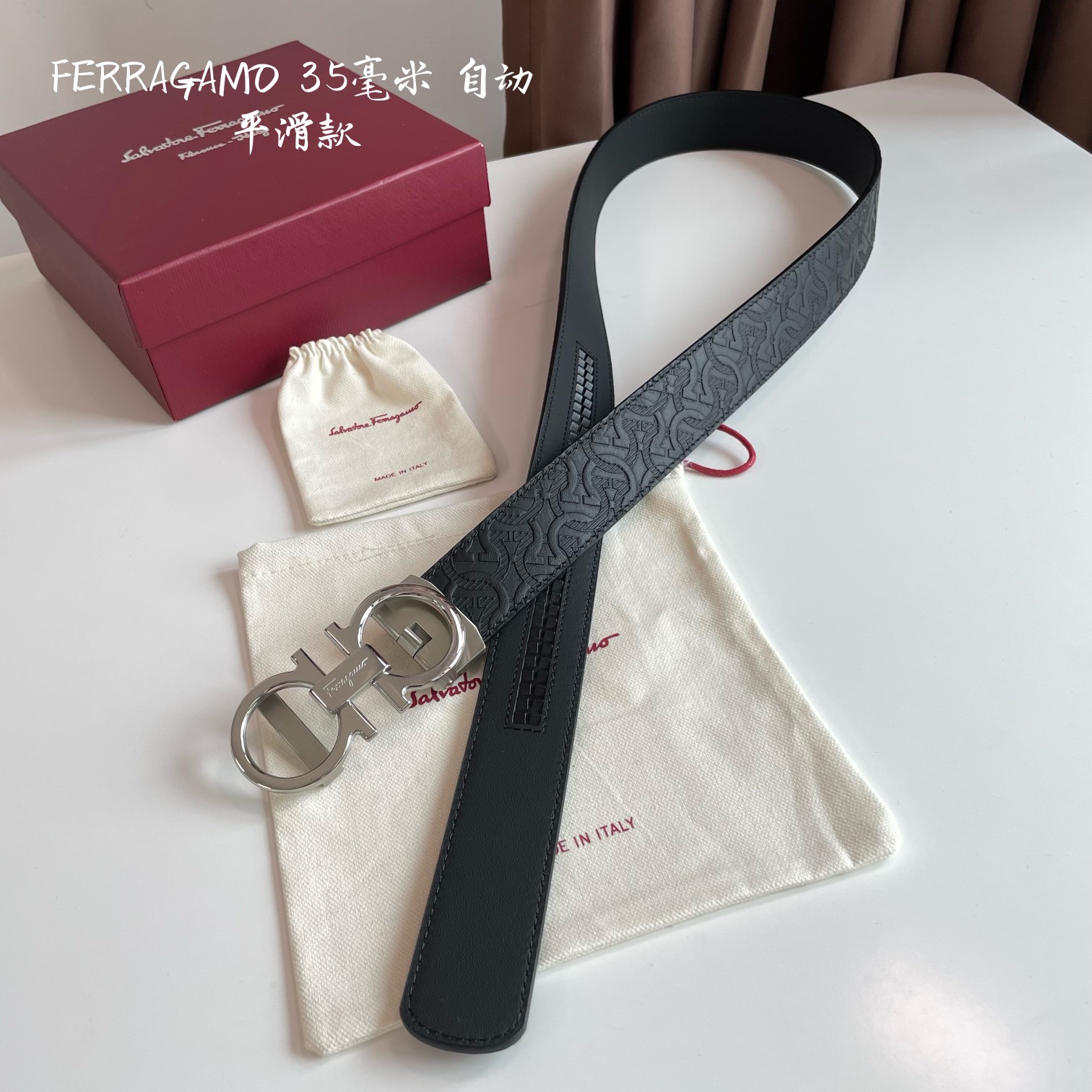 db9bf2_99b83b8550864a89ab91c1432b38a0a1mv2.jpg Ferragamo Logo Buckle Automatic Smoothing Leather Belt - Image 1