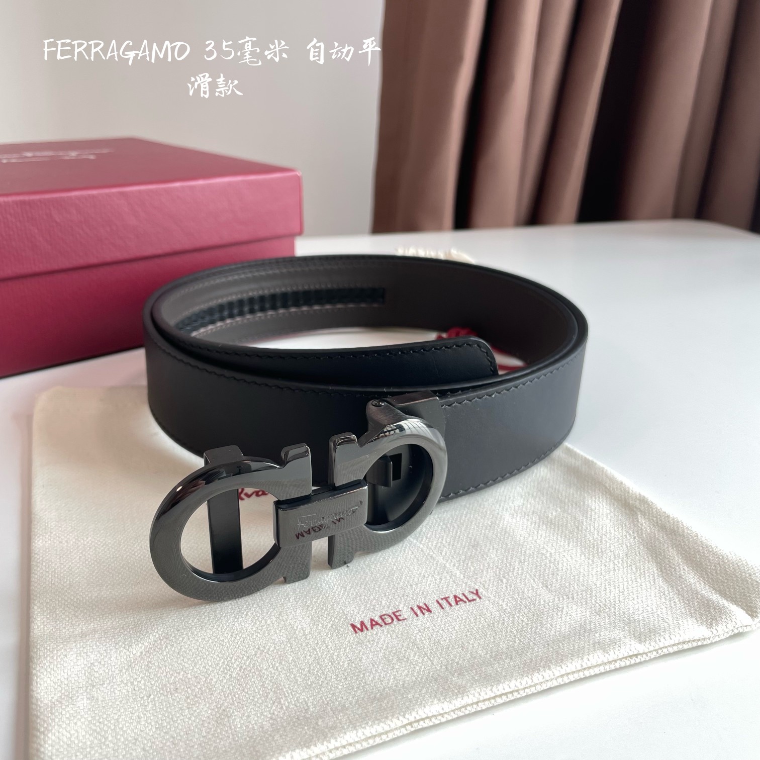 db9bf2_a4a6310d3ffb484b894544a447909ba2mv2.jpg Ferragamo Logo Buckle Automatic Smoothing Leather Belt - Image 1