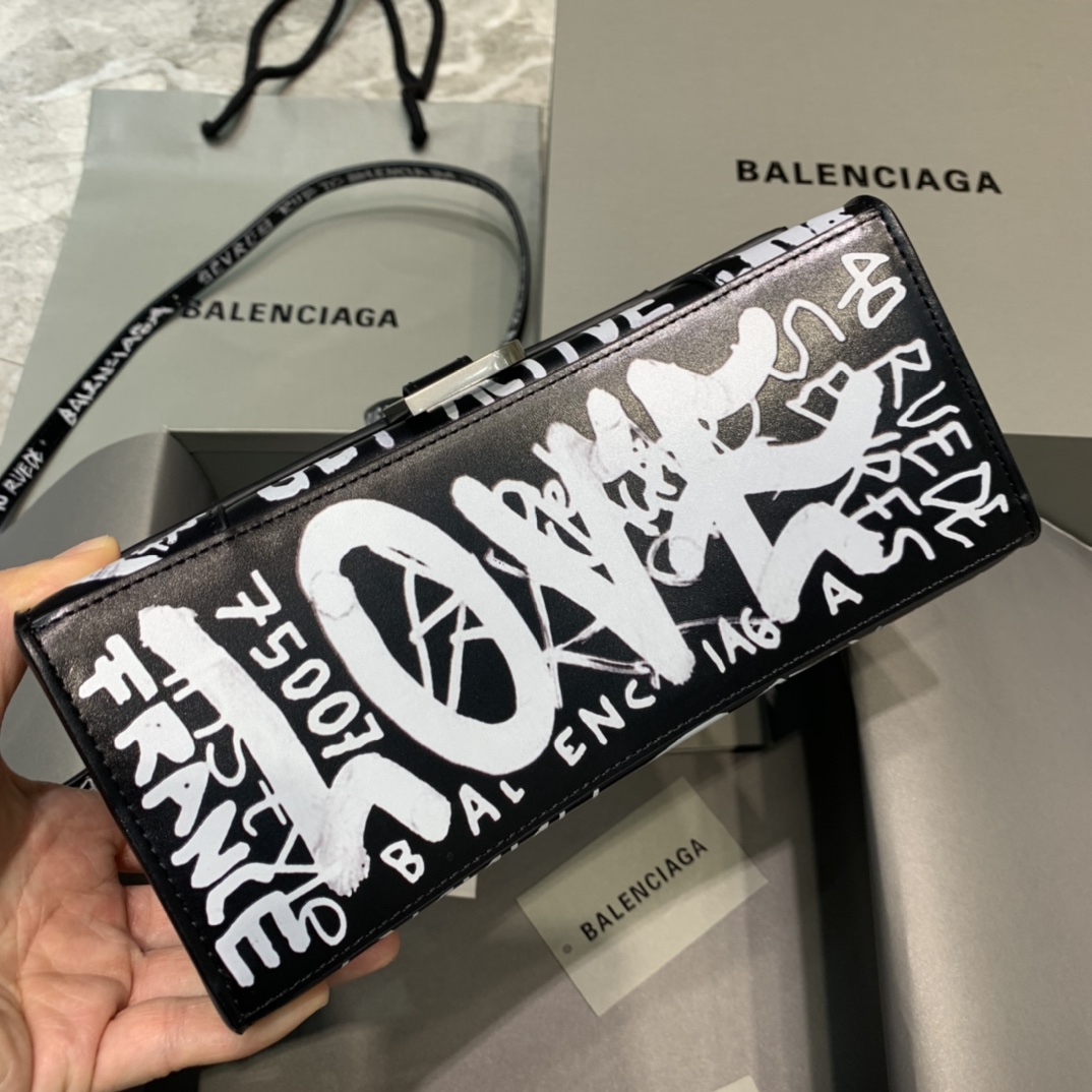 db9bf2_b6e26139f9c7429ebeda809bb44ad443mv2.jpg Balenciaga Small Hourglass Bag in Graffiti Black - Image 1