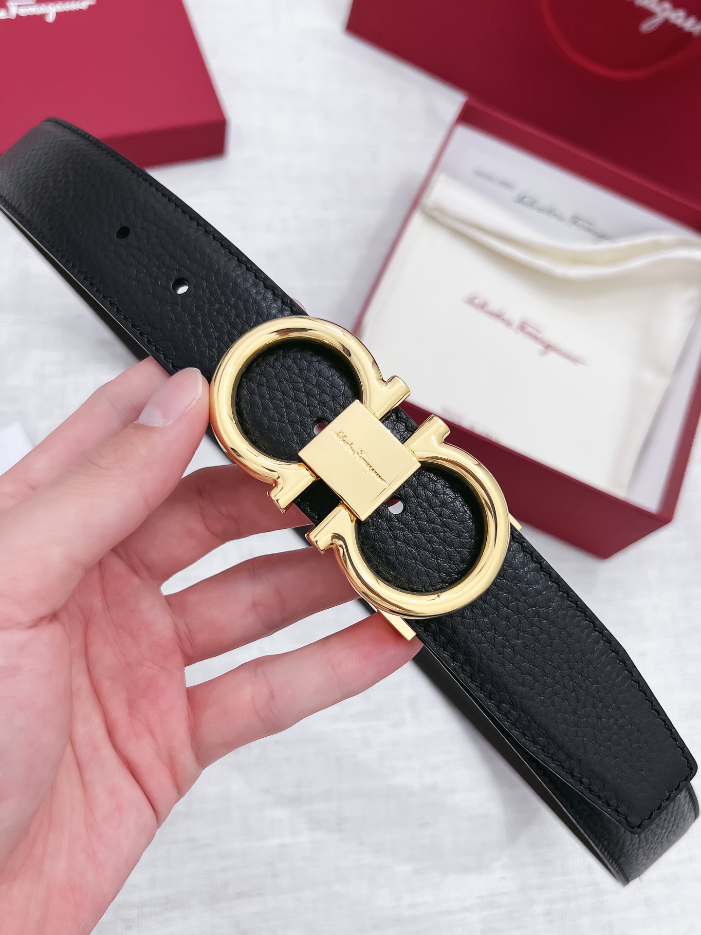 db9bf2_bfade7d05b944833afebba72eeb44f80mv2.jpg Ferragamo Logo Buckle Leather Belt - Image 1