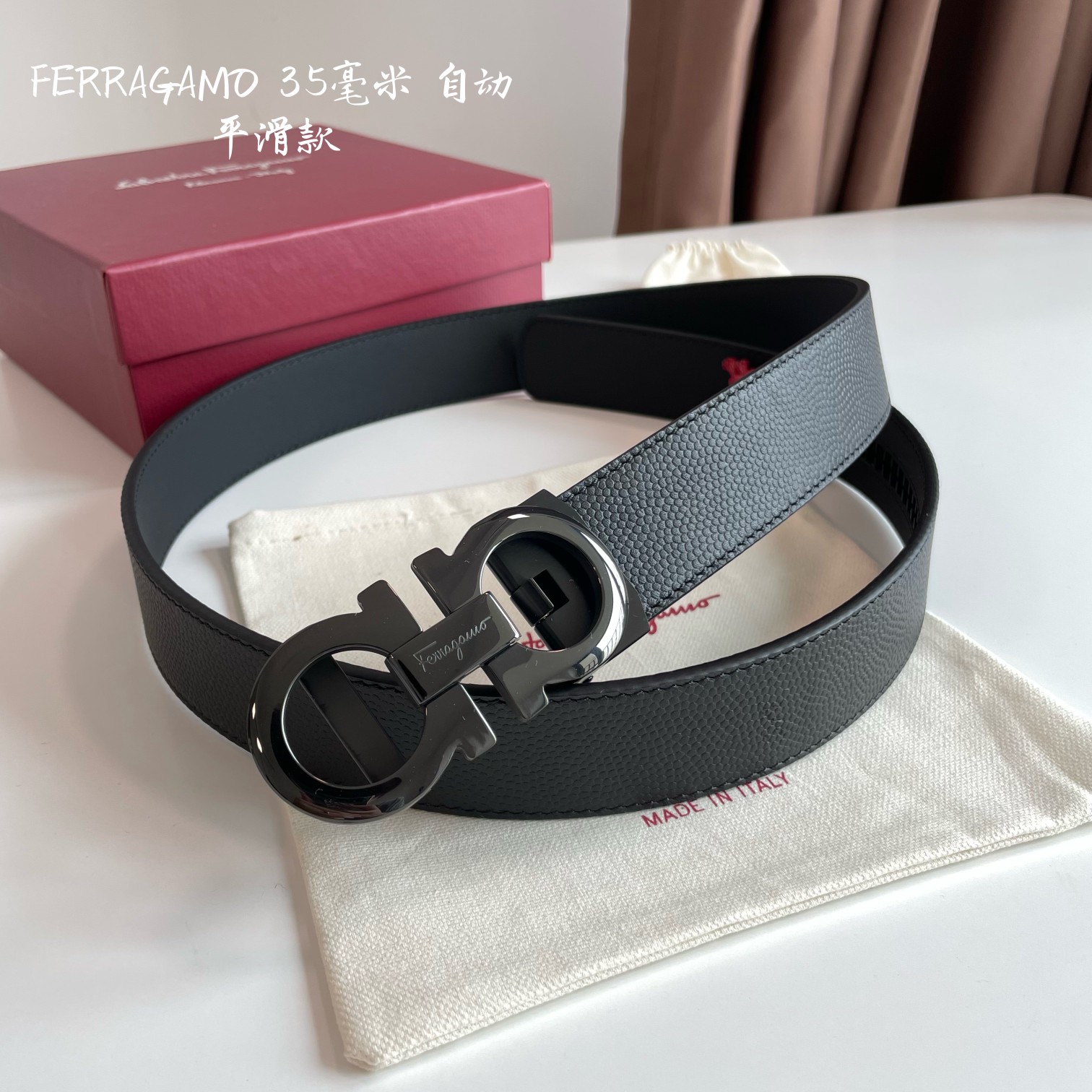 db9bf2_ede8afaa99ef437db3e5bf92dcb0e410mv2.jpg Ferragamo Logo Buckle Automatic Smoothing Leather Belt - Image 1