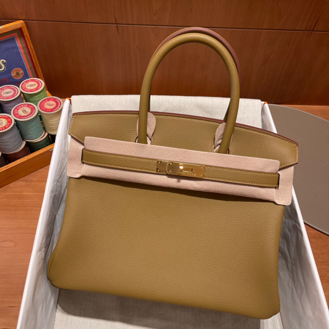 fb638e_1a9a8e10c1d649d6b6117092a0ddedffmv2.jpg Birkin 30 Togo Copper Gold - Image 1