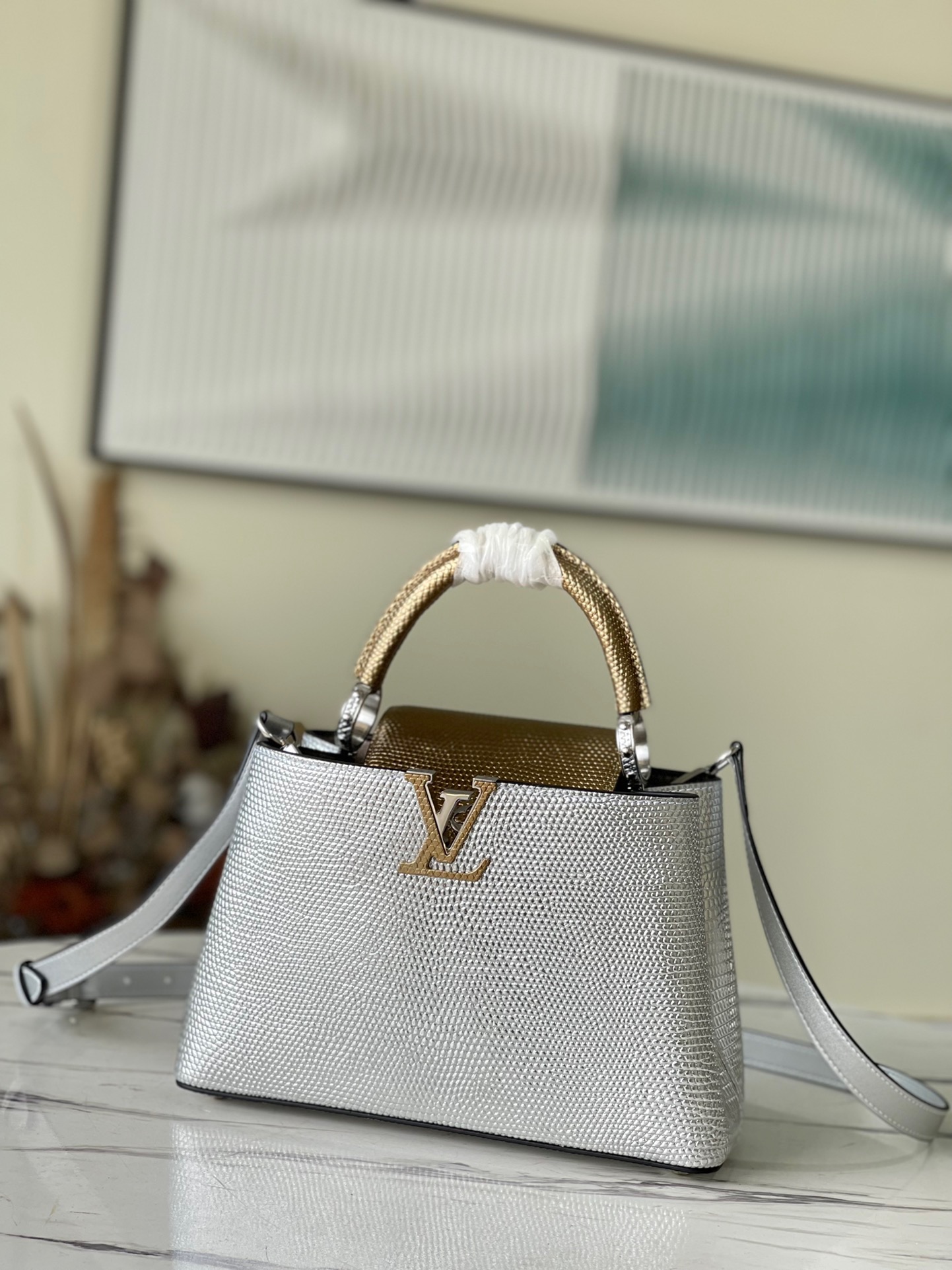 fb638e_3892c79d6e1b48a48b2c23725300aa26mv2.jpg Louis Vuitton Capucines BB Small Handbag in Silver and Gold - Image 1