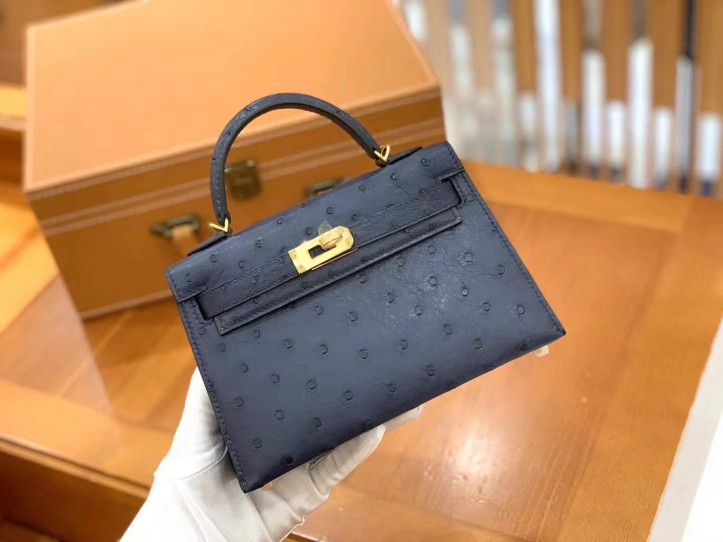 fb638e_8a206d68f6a74575b20f9124b2df39cemv2.jpg Mini Kelly Ostrich Midnight Blue - Image 1