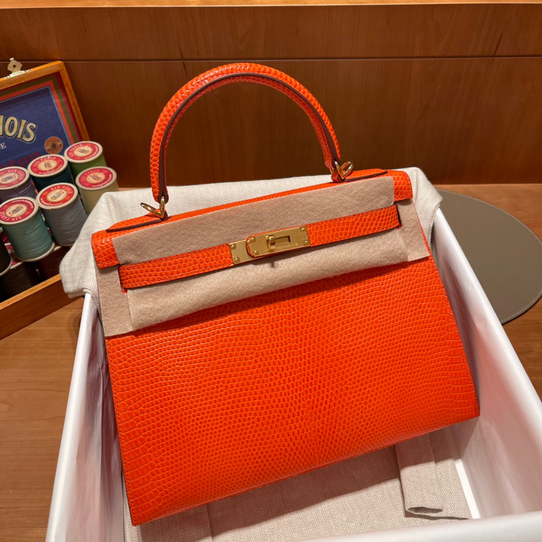 fb638e_8b5ad7f5e9004dfd958c0fd56db9da68mv2.jpg Kelly 28 Lizard Flame Orange - Image 1