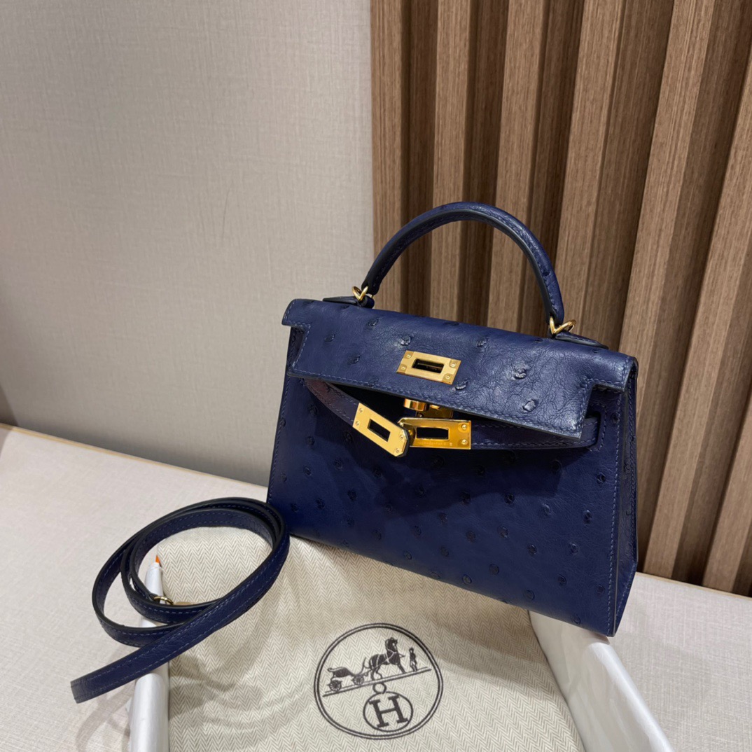 fb638e_a9a8833e443e40f996cd2348757b0a84mv2.jpg Mini Kelly Ostrich Sapphire Blue - Image 1
