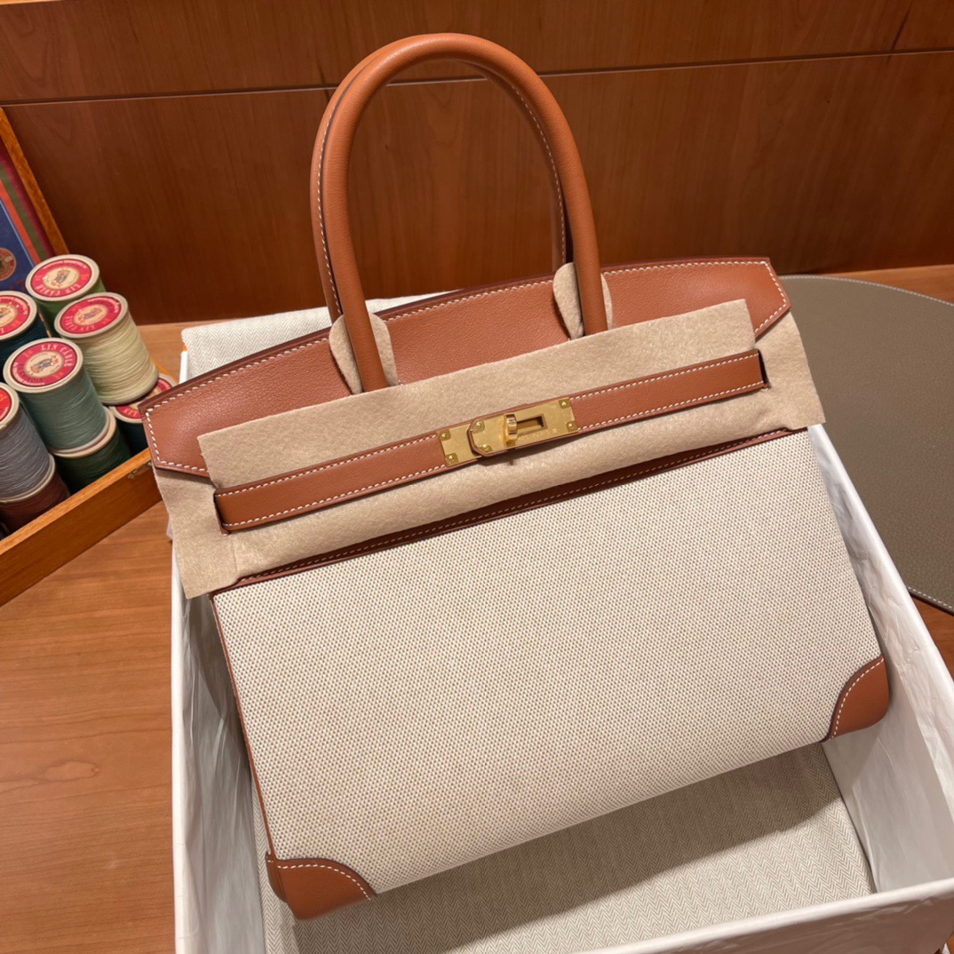 fb638e_c74fd8635bba40fc8db024f740aafb79mv2.jpg Birkin HAC Canvas&Swift Gold Brown - Image 1