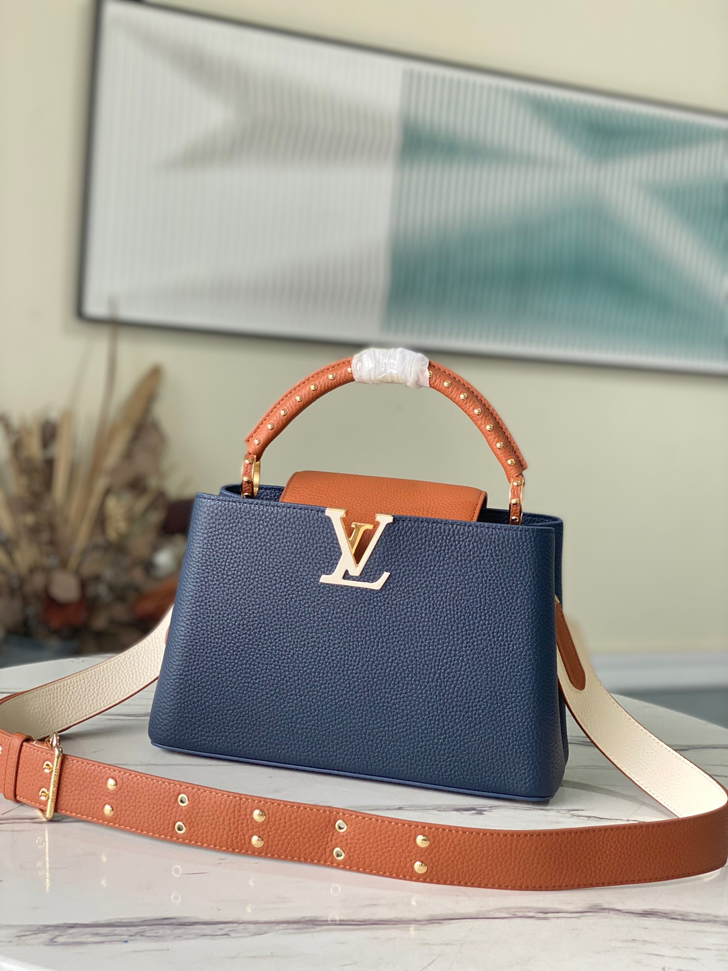 fb638e_c7e9ae63cfd04801bbe54ad07761be46mv2.jpg Louis Vuitton Capucines BB Medium Handbag in Dark Blue&Brown - Image 1