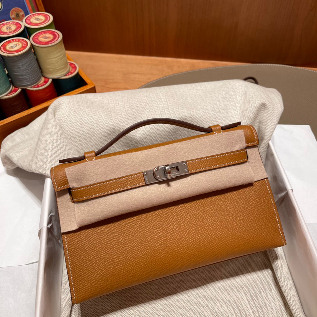 fb638e_ce71ec0483524749a1063858e9df1f9bmv2.jpg Kelly Pochette Epsom Golden Brown - Image 1