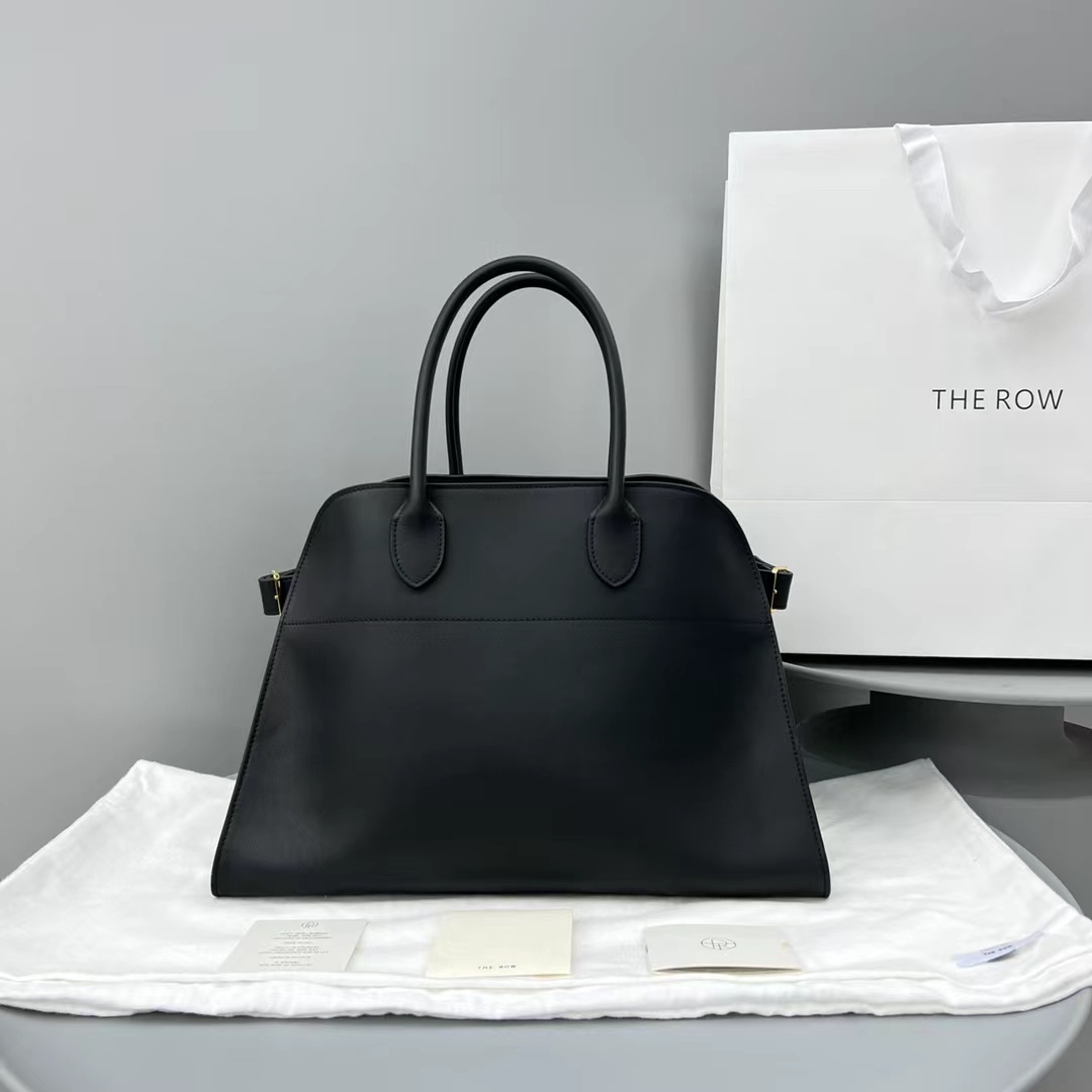 fb638e_dd62bcd18c9f40c19a1336cebd3dd2a8mv2.jpg The Row Margaux 17 Tote in Black Leather - Image 1