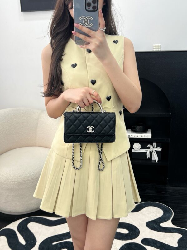 Chanel black handle bag 2025